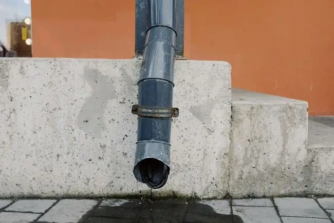 water dripping from the end of a downspout