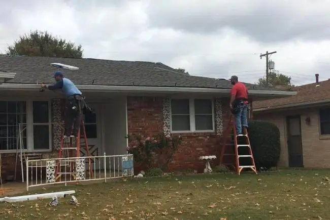 maupin roofing team replacing gutters