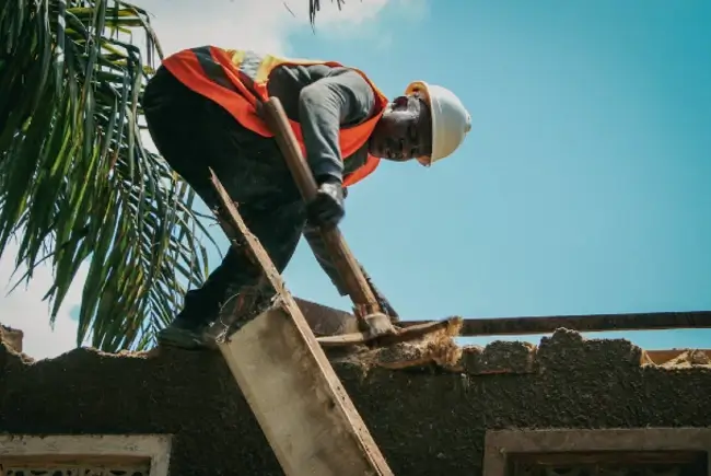 roofer replacing shingles