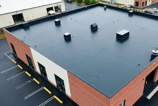 top view of a brick building with mod bit roofing