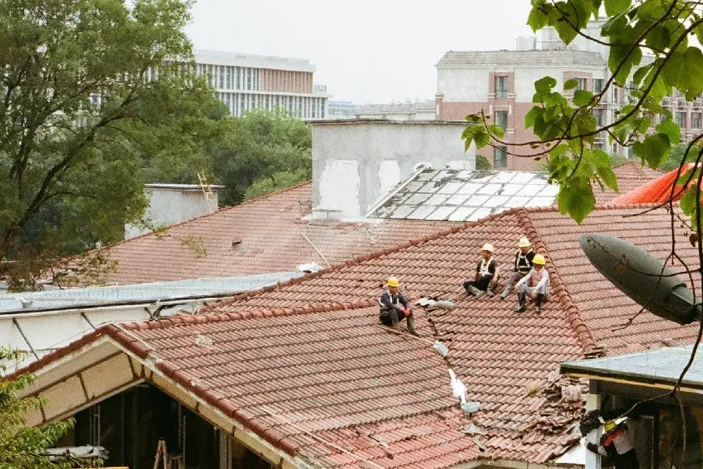 contractors working on wind resistant roofing