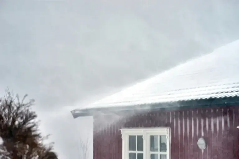 ongoing hailstorm, with hail covering the whole roof of the house.