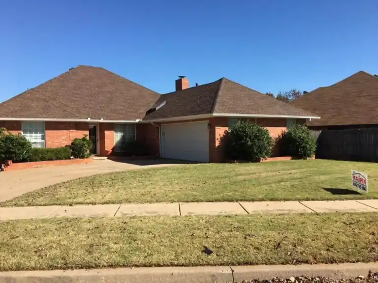 Brick ranch home with a completed new shingle roof